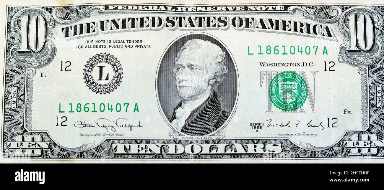 Large fragment of the obverse side of old 10 $ ten American dollars bill banknote series 1988 features the portrait of Alexander Hamilton, who served Stock Photo