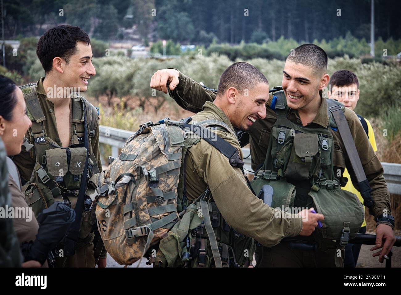 The Golani soldiers laughing and hugging in the city of Golani Junction, Israel Stock Photo
