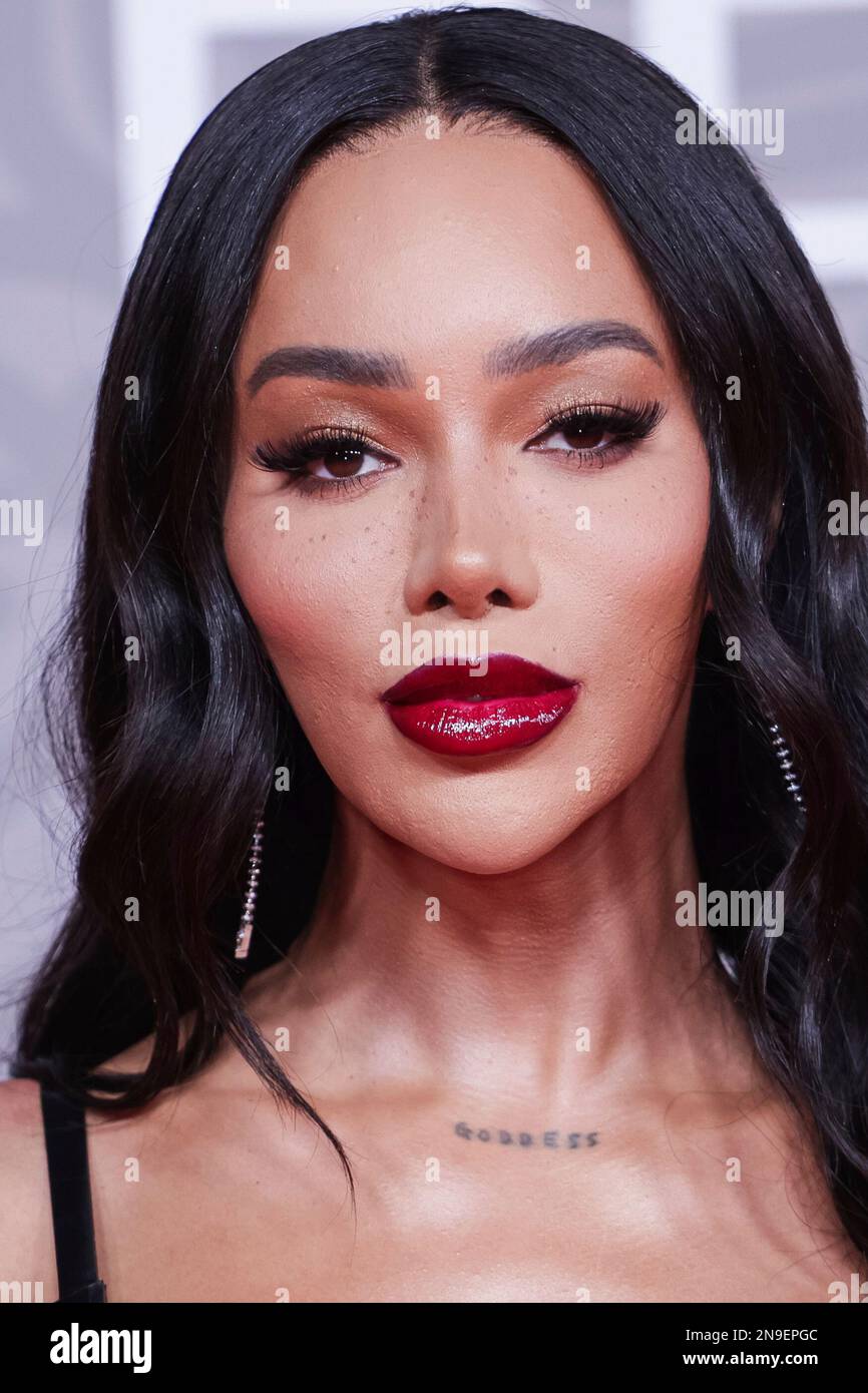 Munroe Bergdorf poses for photographers upon arrival at the Brit Awards