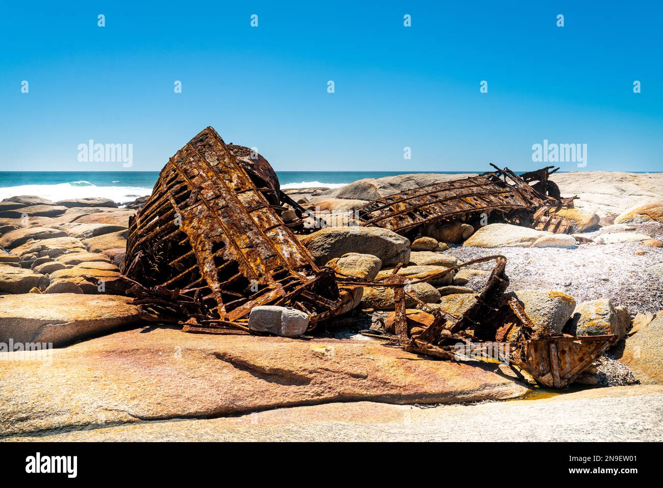The wreck of the Aristea lies on the rocks on the Atlantic Ocean coast near Hondeklip Bay in South Africa. The ship ran aground in 1945 and corrodes. Stock Photo