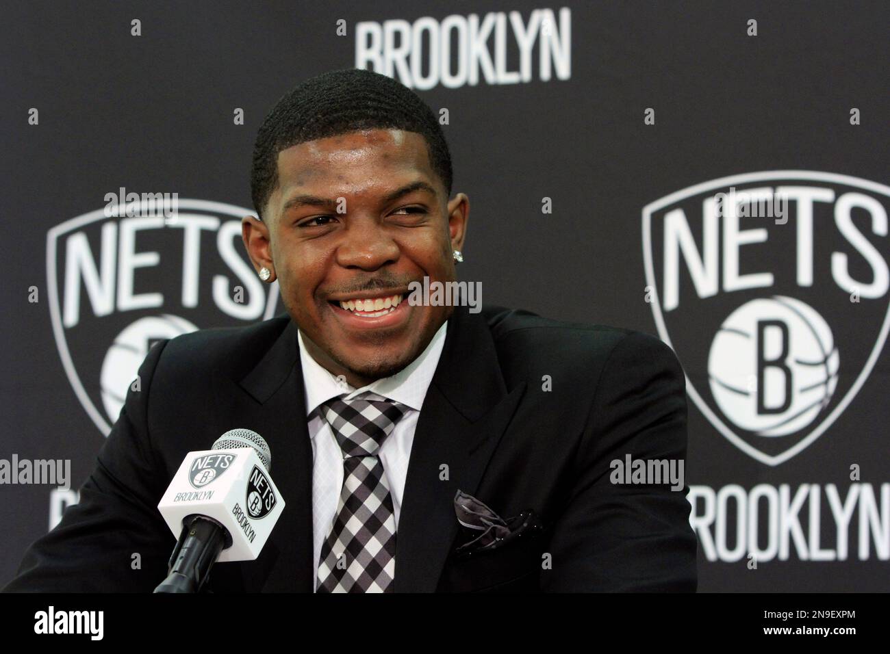 Joe Johnson smiles during his introduction at a news conference for the