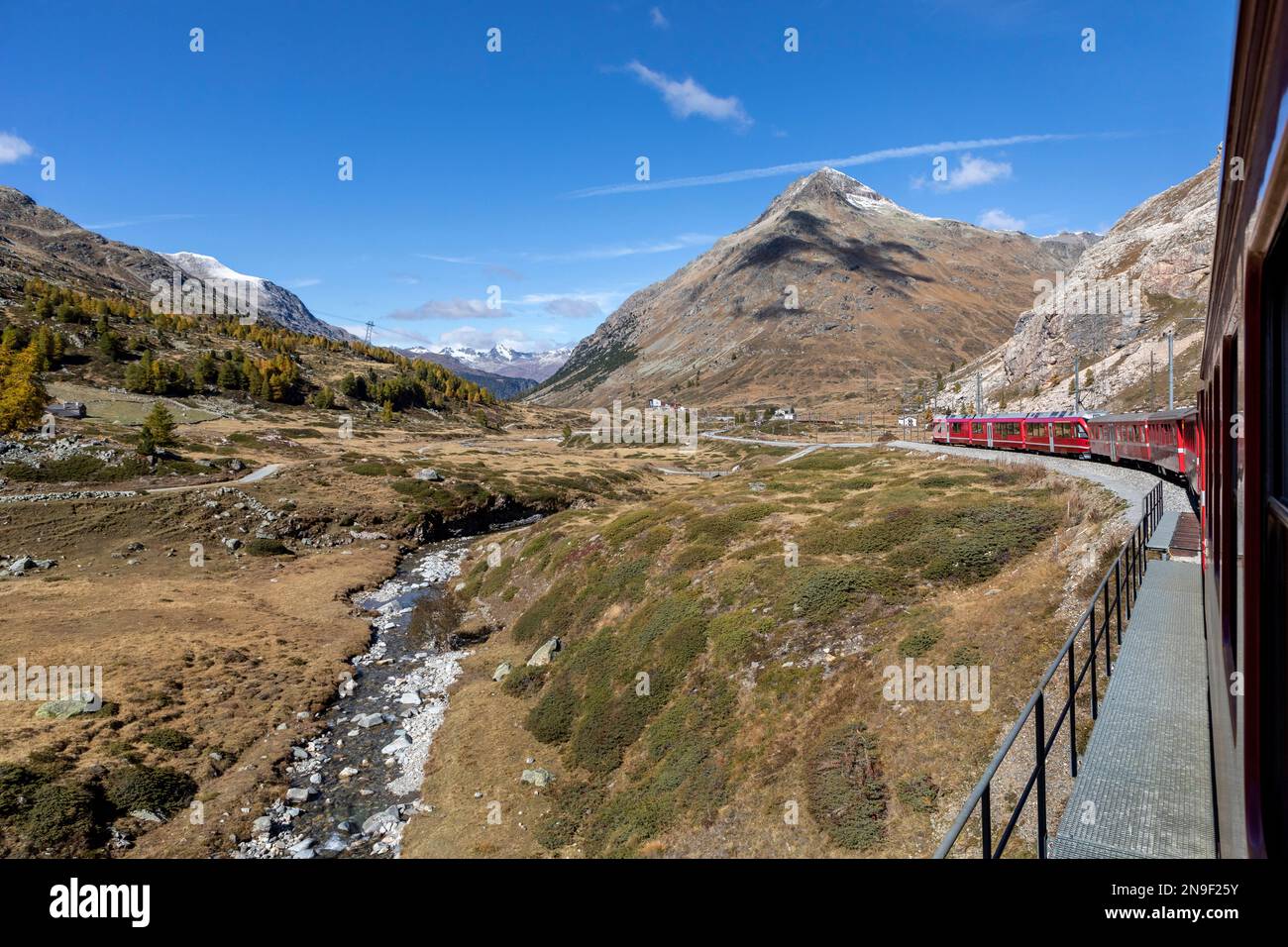 bernina express mountain railway train approaching bernina lagalb