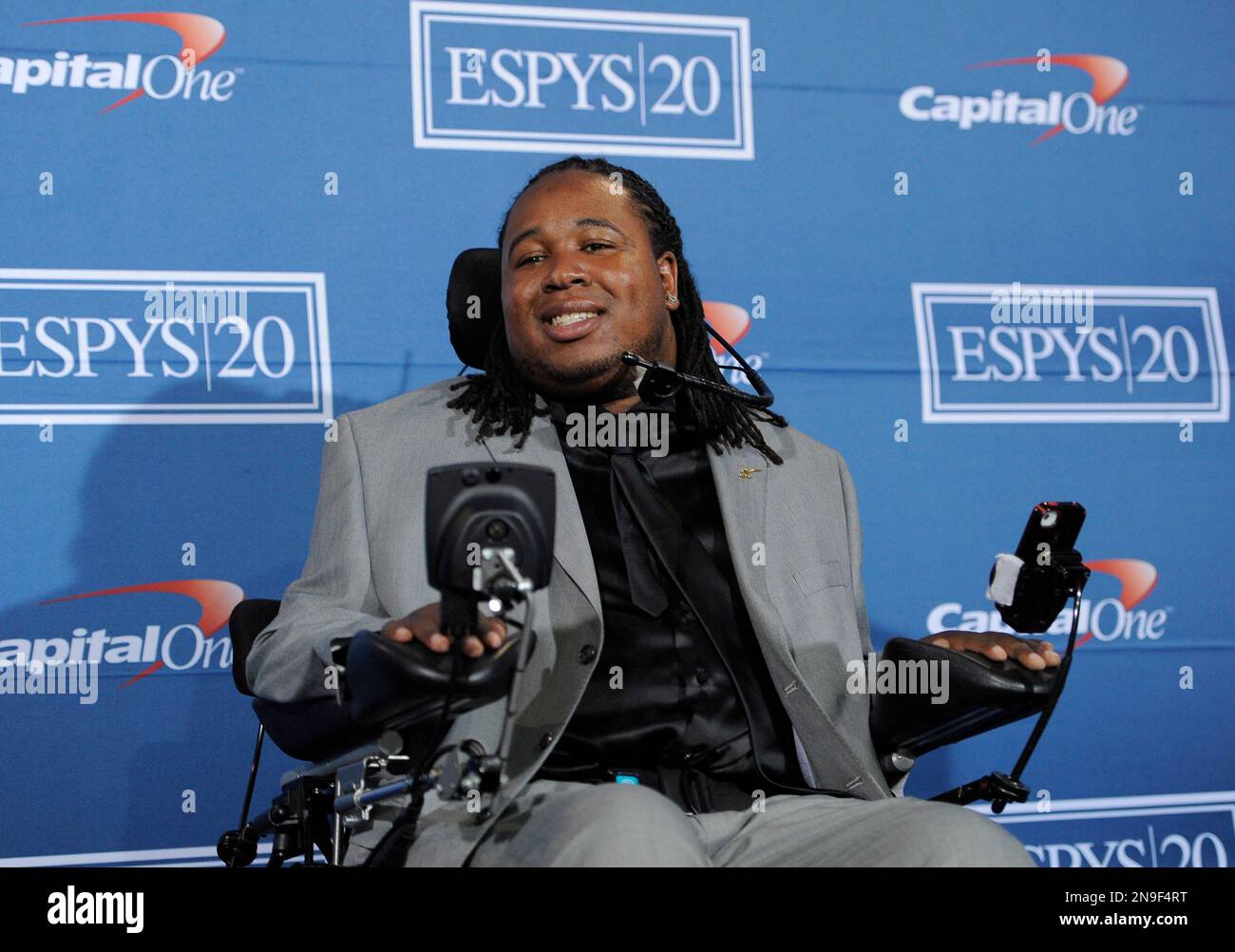 Paralyzed Rutgers football player Eric LeGrand poses backstage with the