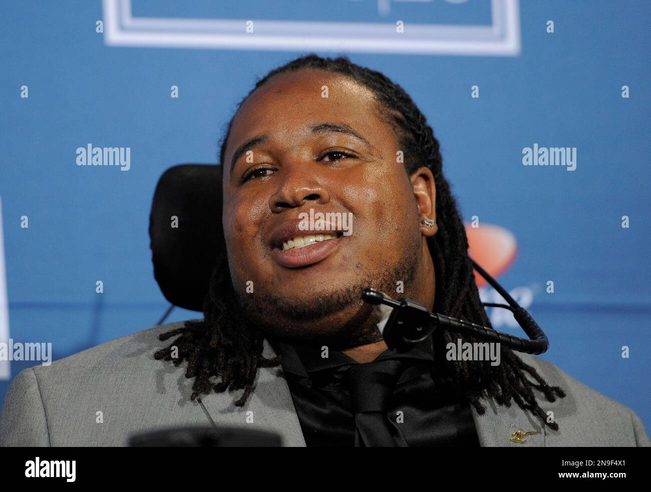 Paralyzed Rutgers football player Eric LeGrand poses backstage with the