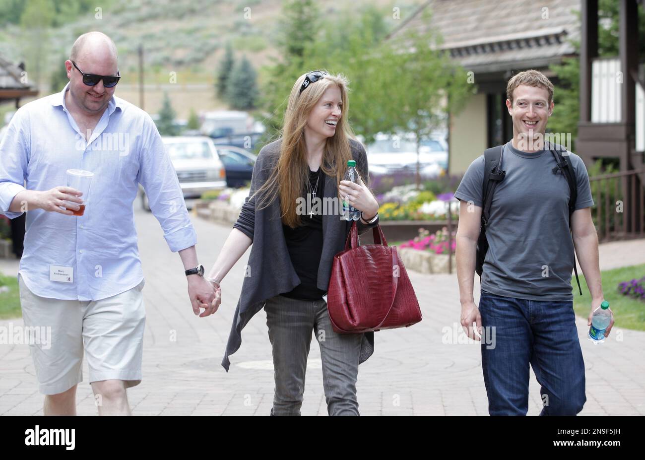 Facebook CEO Mark Zuckerberg, right, walks with Laura Arrillaga-Andressen,  center, wife of Marc Andressen, left, at the Allen & Company Sun Valley  Conference in Sun Valley, Idaho, Wednesday, July 11, 2012. Marc