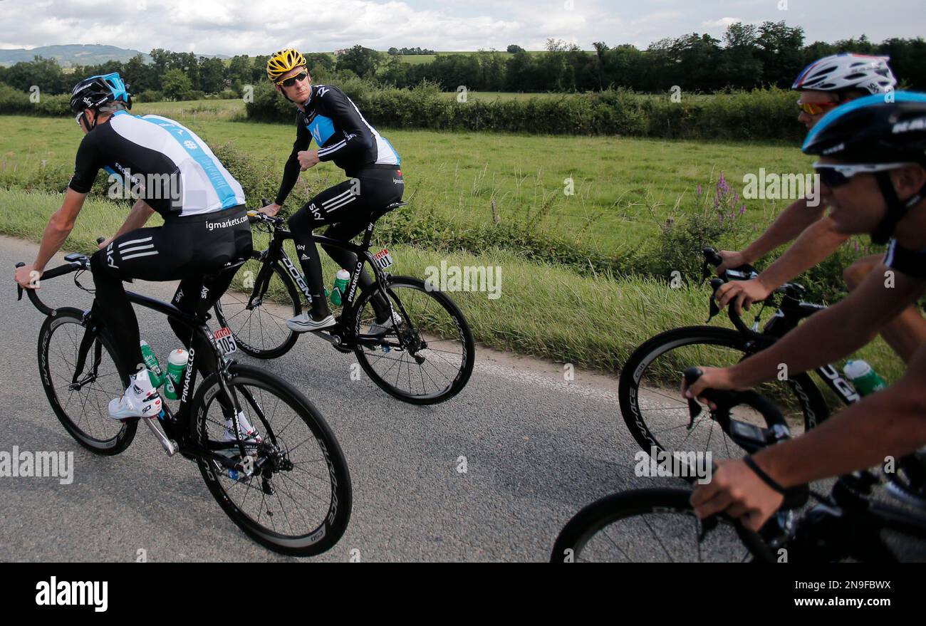 Overall leader Bradley Wiggins of Britain turns back as he rides
