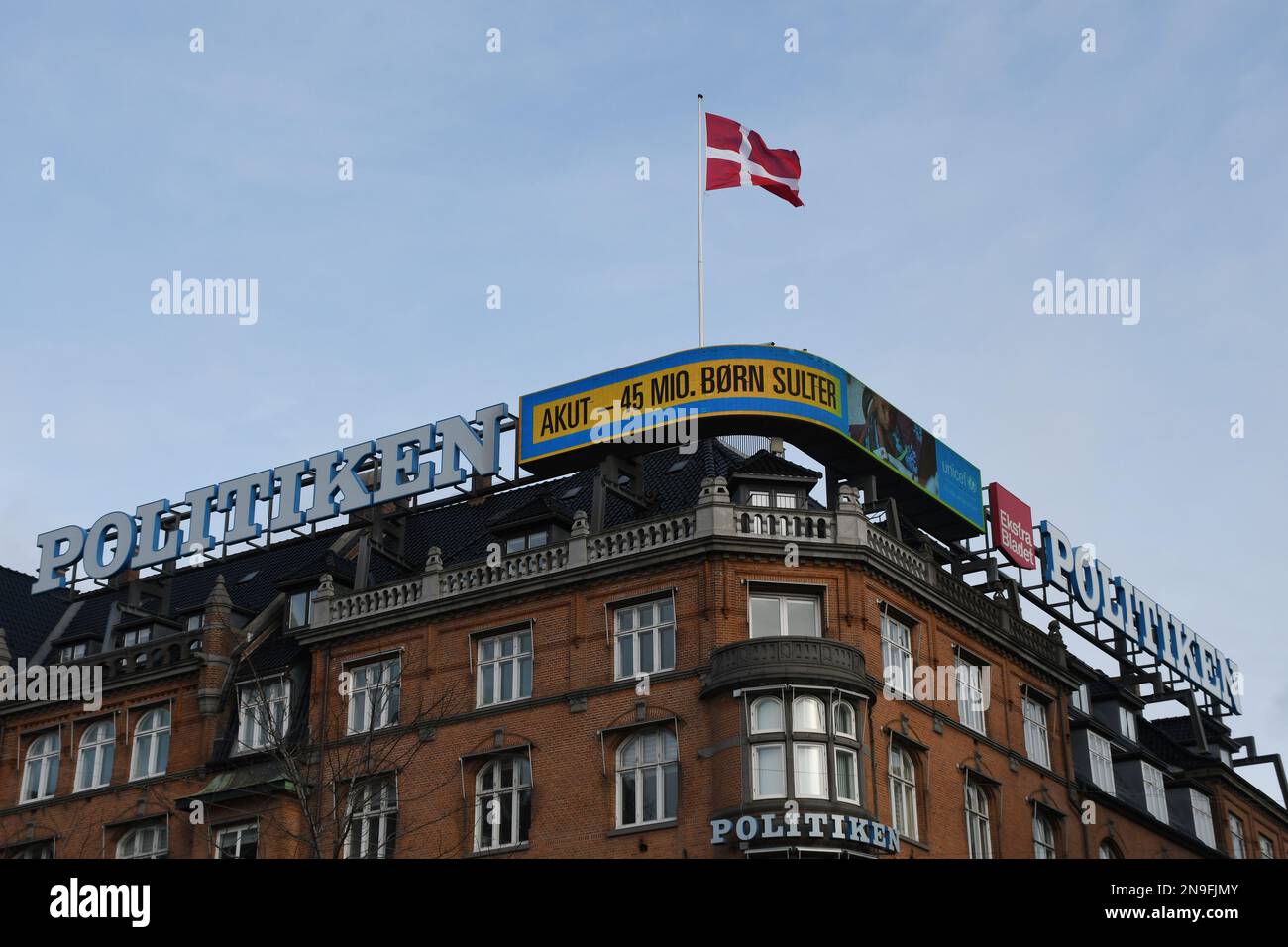 Copenhagen/Denmark/12 February 2023/ Danish media Politken hus  danish media house fly dnnebrog  danish flag on memdia house in capital Copenhagen Denmark.  (Photo. Francis Joseph Dean/Dean Pictures) Stock Photo