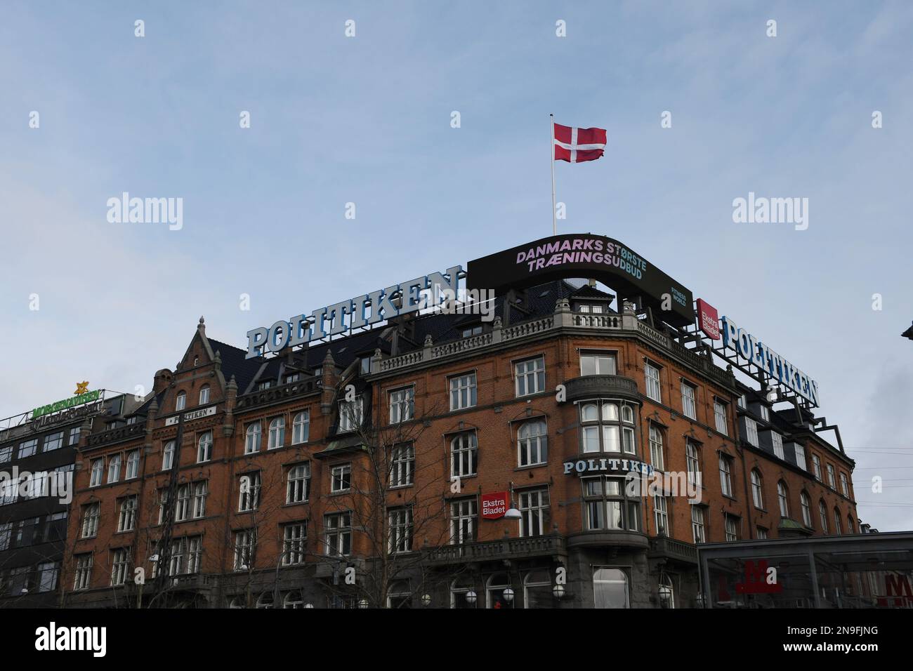 Copenhagen/Denmark/12 February 2023/ Danish media Politken hus  danish media house fly dnnebrog  danish flag on memdia house in capital Copenhagen Denmark.  (Photo. Francis Joseph Dean/Dean Pictures) Stock Photo