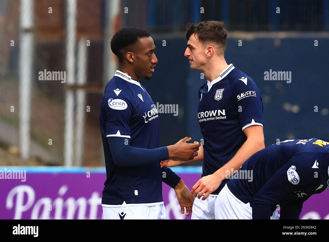 Dundee, Scotland, UK. 12th February 2023; Dens Park, Dundee, Scotland:  Scottish Championship Football Dundee versus Cove Rangers; Zach Robinson of Dundee is congratulated after scoring for 1-0 by Barry Maguire Credit: Action Plus Sports Images/Alamy Live News Stock Photo