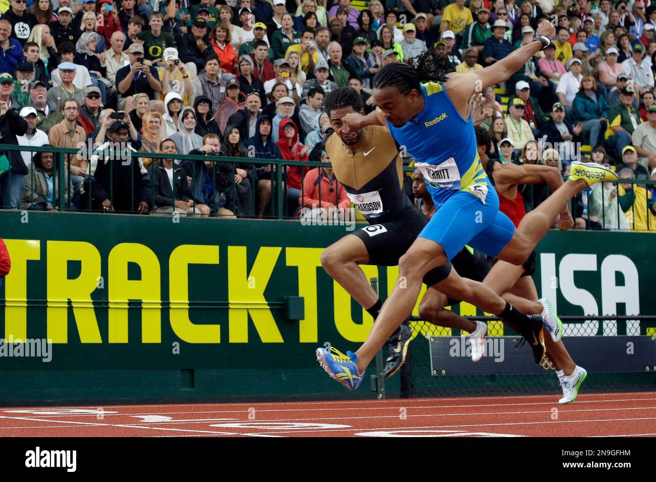Aries Merritt and Jason Richardson cross the finish line during the men