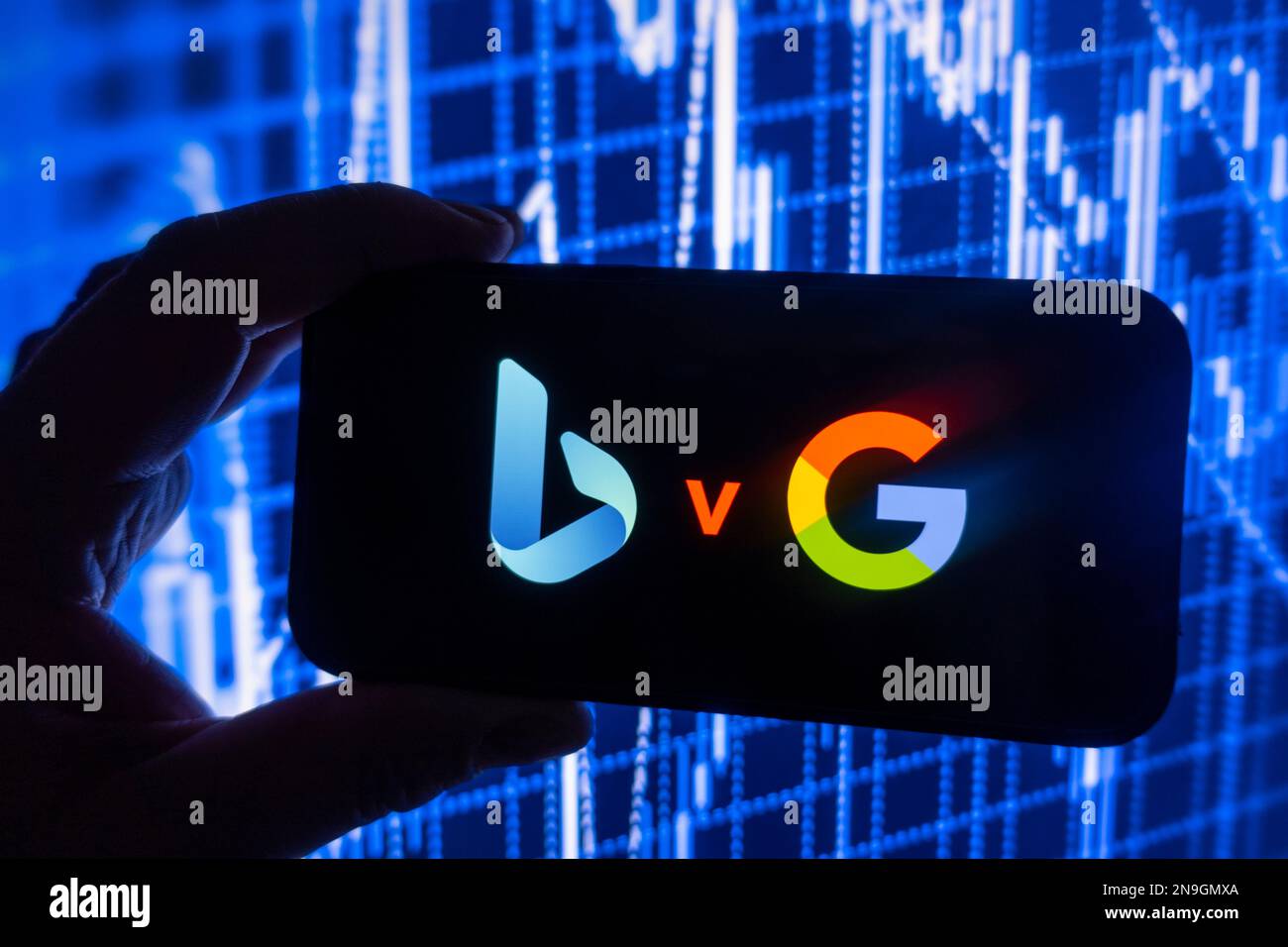 Digital composite image showing Microsoft Bing search engine powered by ChatGPT and Google search on a mobile phone. Stock Photo