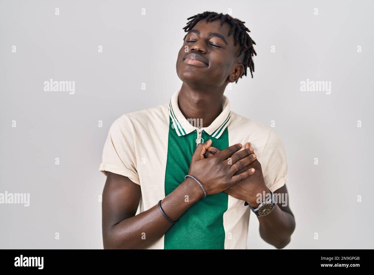Dreadlocks Chest African man with dreadlocks standing over isolated background smiling ...