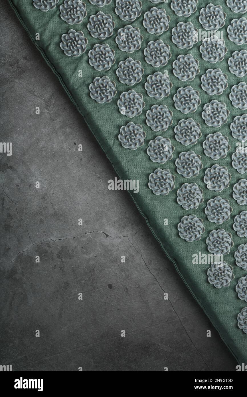 Massage mat with prickly spikes applicator top view. On a