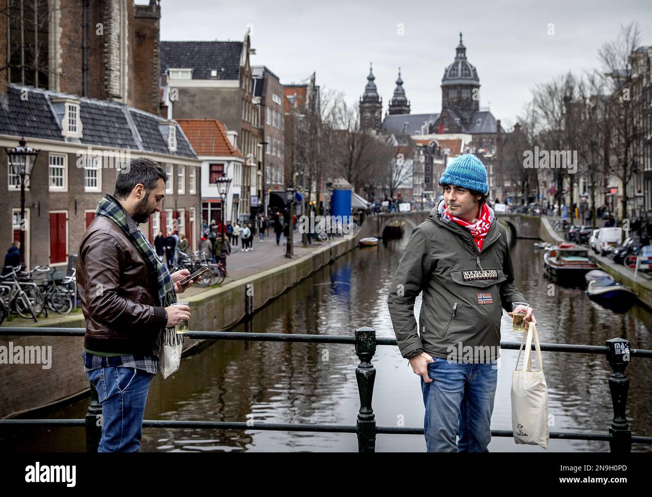 AMSTERDAM - A tourist with a joint in the Red Light District. In the fight  against nuisance caused by drug use in public spaces, it is prohibited from  mid-May to smoke weed