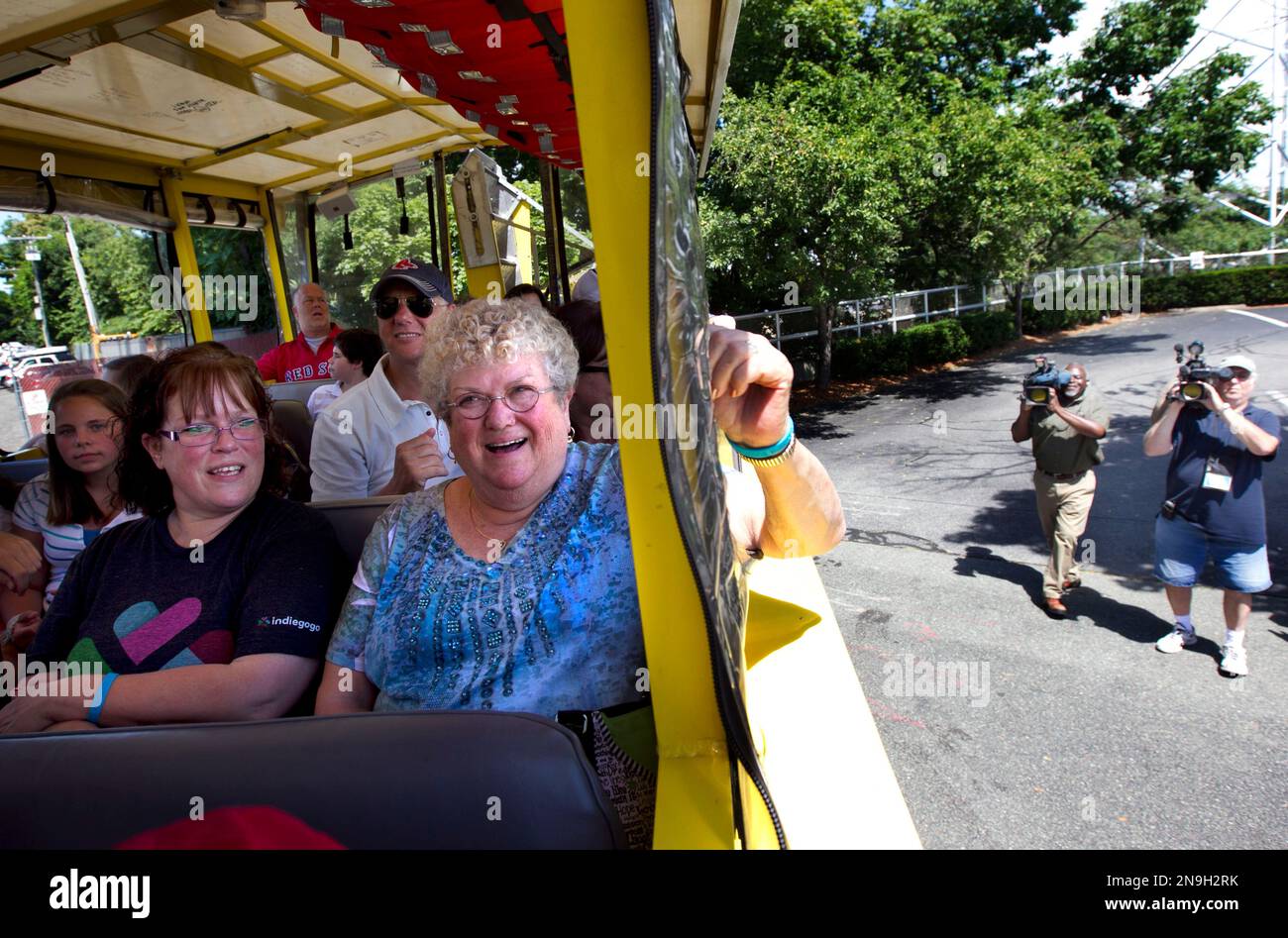 Bus monitor Karen Klein, of Greece, N.Y., center, sits next to her