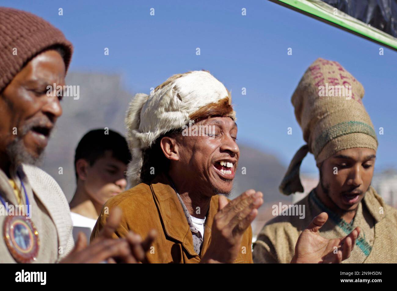 A men form the Khoisan ethnic group sing during a poster unveiling ...