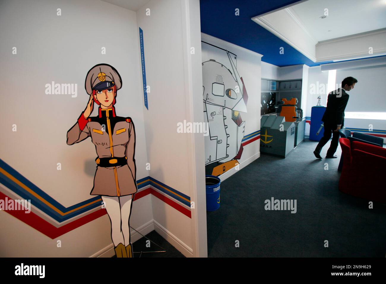 A cutout of Lt. Matilda Ajan, a Gundam character, greets guests in a  special room designed after the popular Japanese animation series at a  hotel in Tokyo Thursday, June 28, 2012, one