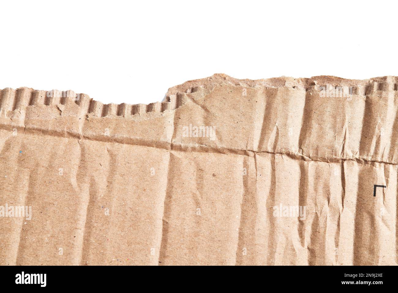 One ripped piece of cardboard material over isolated white background ...