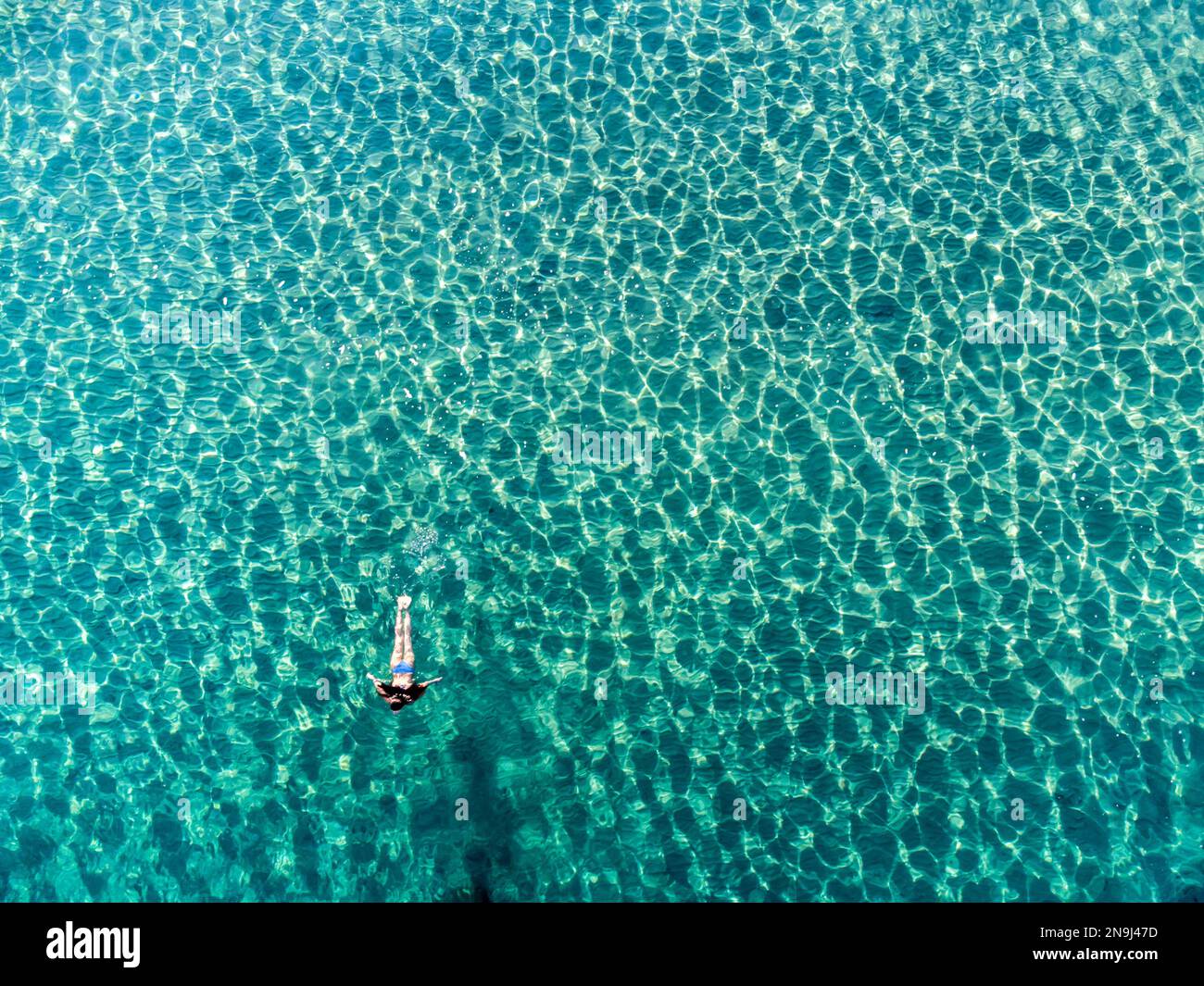 Woman swimming in the sea at summer Stock Photo