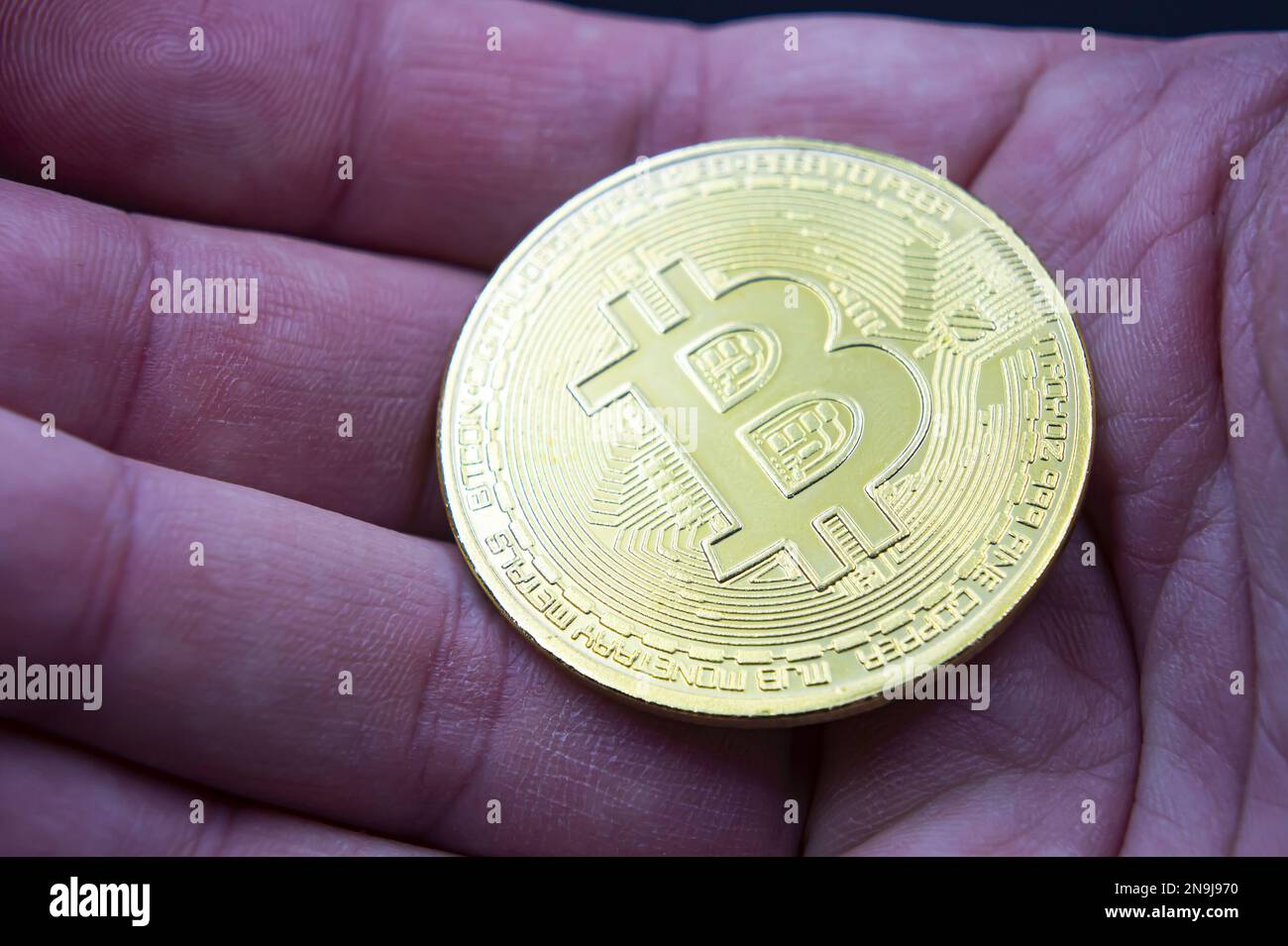 people hold hand BTC gold bitcoin on white background, blockchain and  investment in new cryptocurrency concept Stock Photo - Alamy