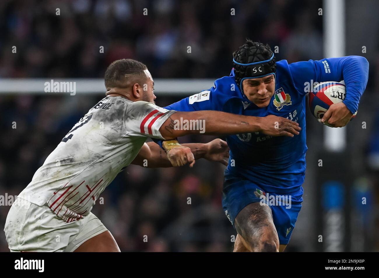Juan Ignacio Brex of Italy is tackled by Ollie Lawrence of England during the 2023 Guinness 6 Nations match England vs Italy at Twickenham Stadium, Twickenham, United Kingdom, 12th February 2023  (Photo by Craig Thomas/News Images) Stock Photo