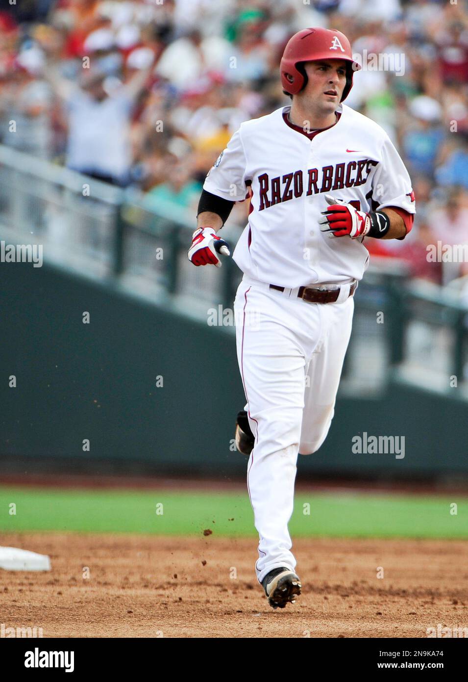Arkansas' Jake Wise rounds the bases after hitting a solo home run