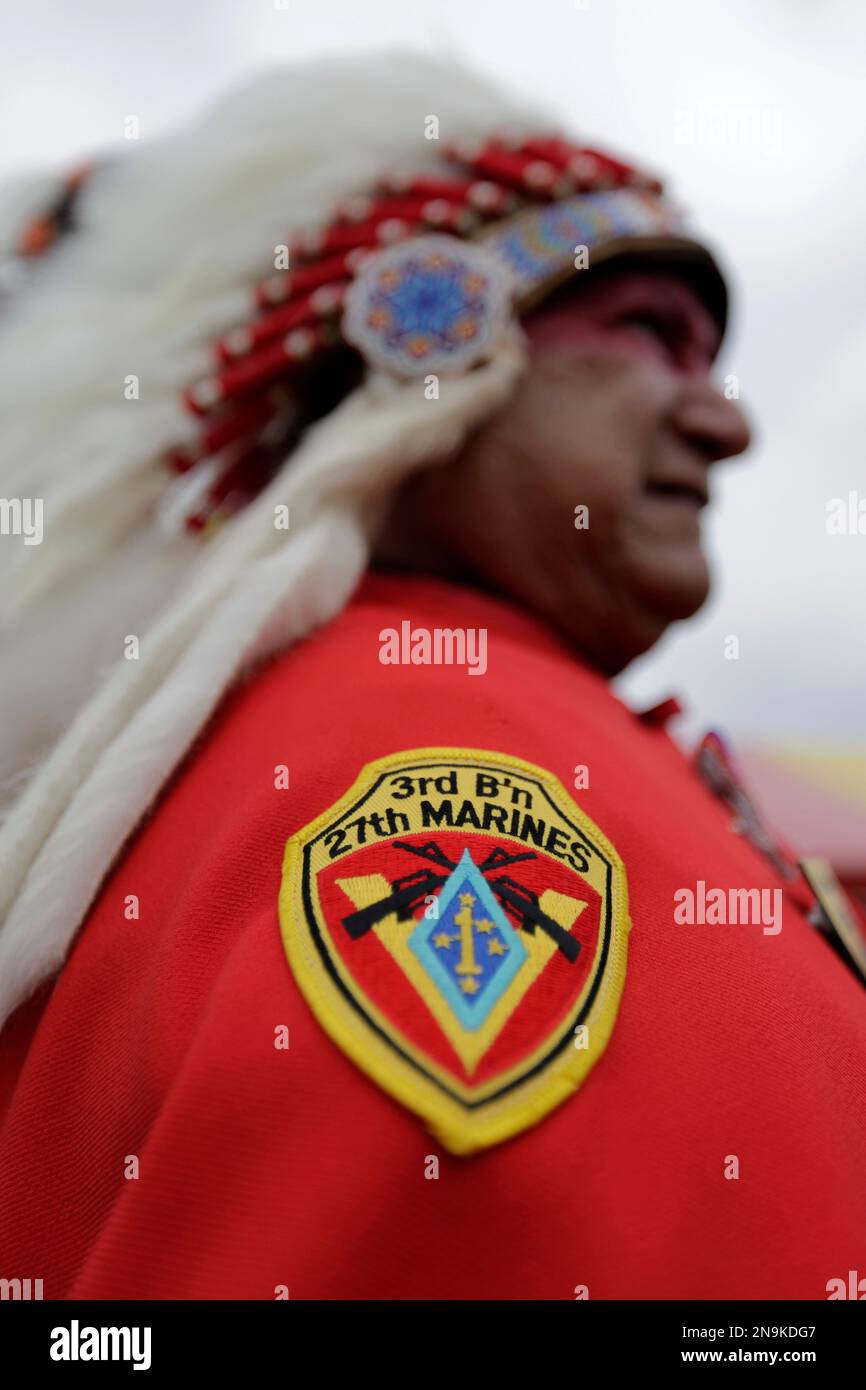 Blas Preciado, left, a Vietnam War veteran of the Kiowa tribe looks on