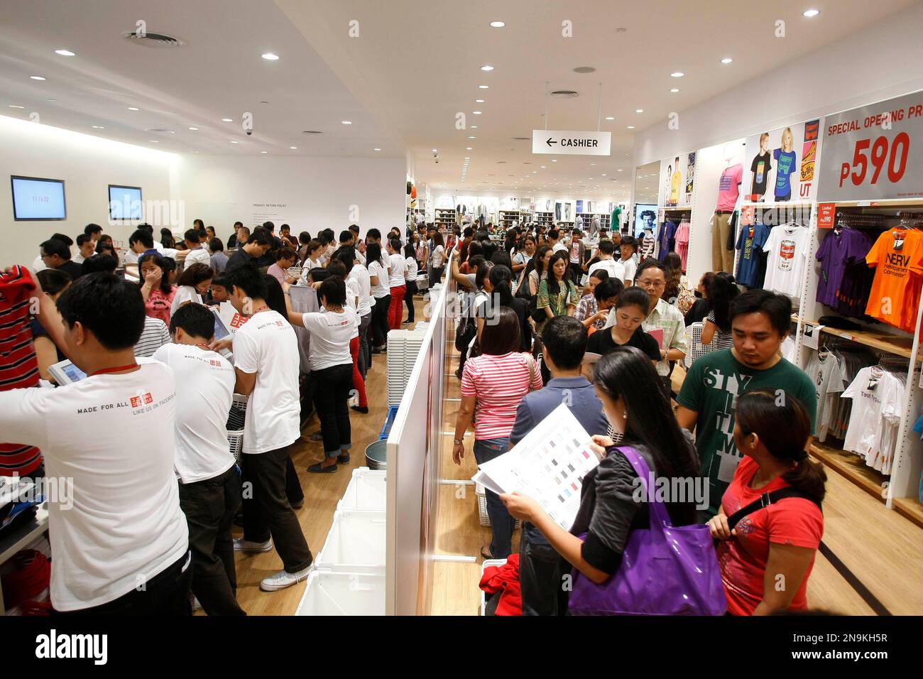 Filipinos at the counter as they shop for clothes and other items at ...