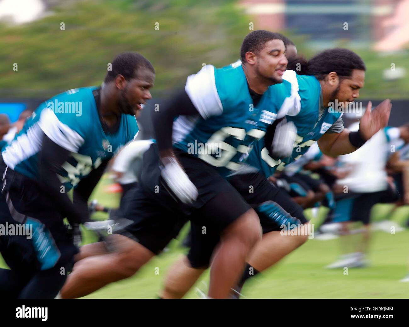 Jacksonville Jaguars players, from left, D'Anthony Smith, Odrick Ray