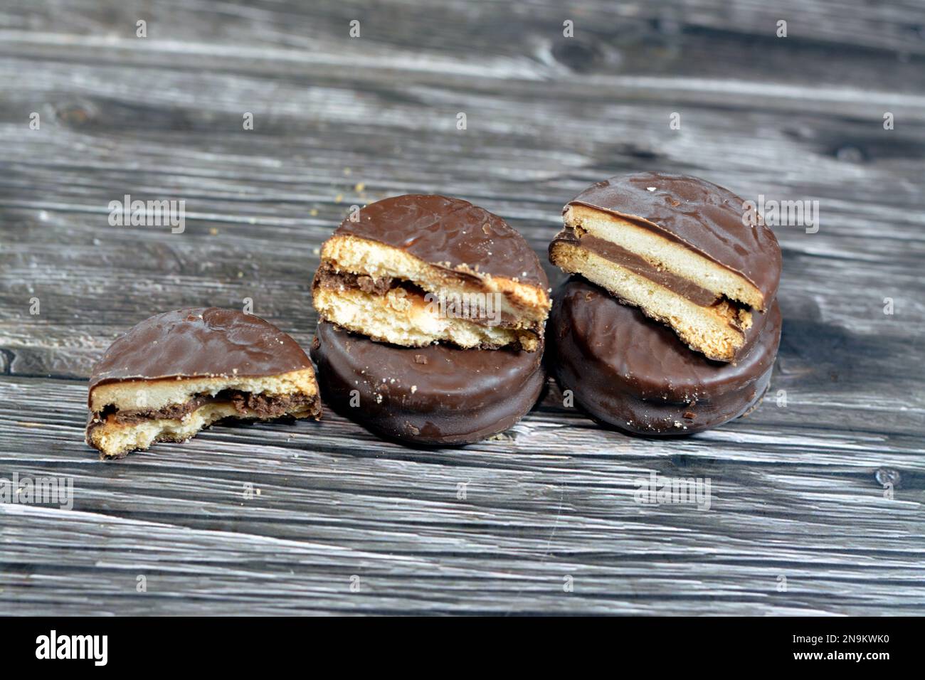 Biscuits filled and coated with natural chocolate, weight gain concept, bakery and pastries