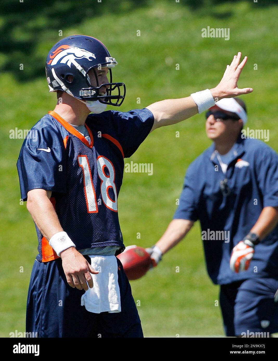 Denver Broncos quarterback Peyton Manning instructs his receivers