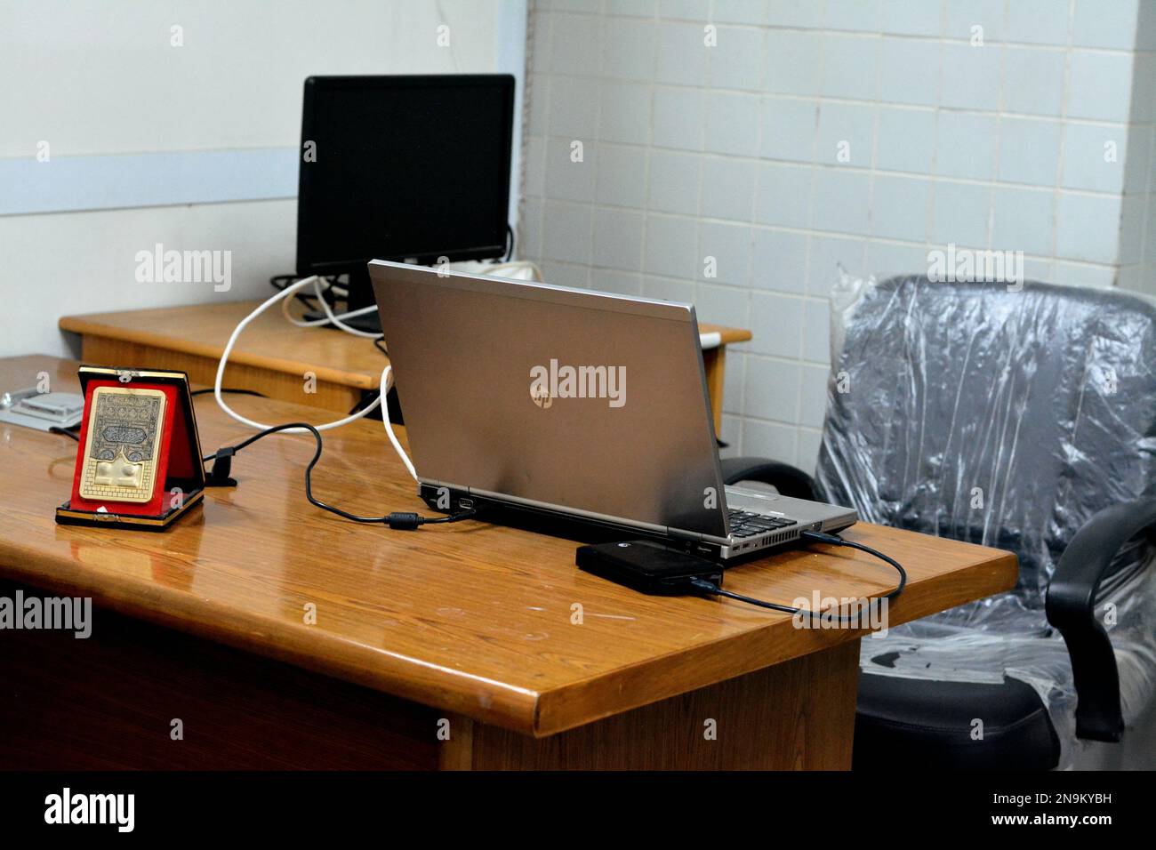 Cairo, Egypt, February 11 2023: A simple workplace with wooden desk and ...