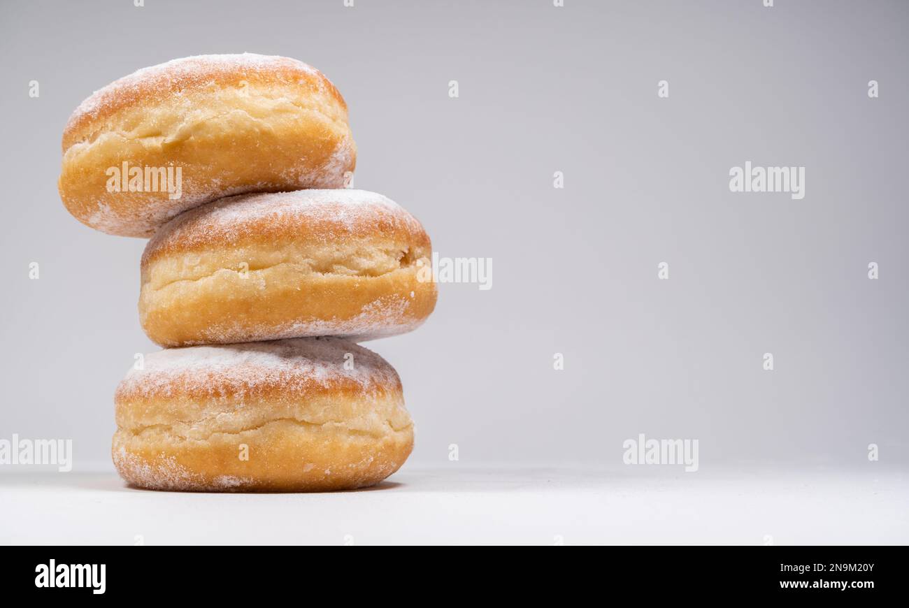 Polish pączki deepfried doughnuts. Celebrating Fat Thursday, Tłusty