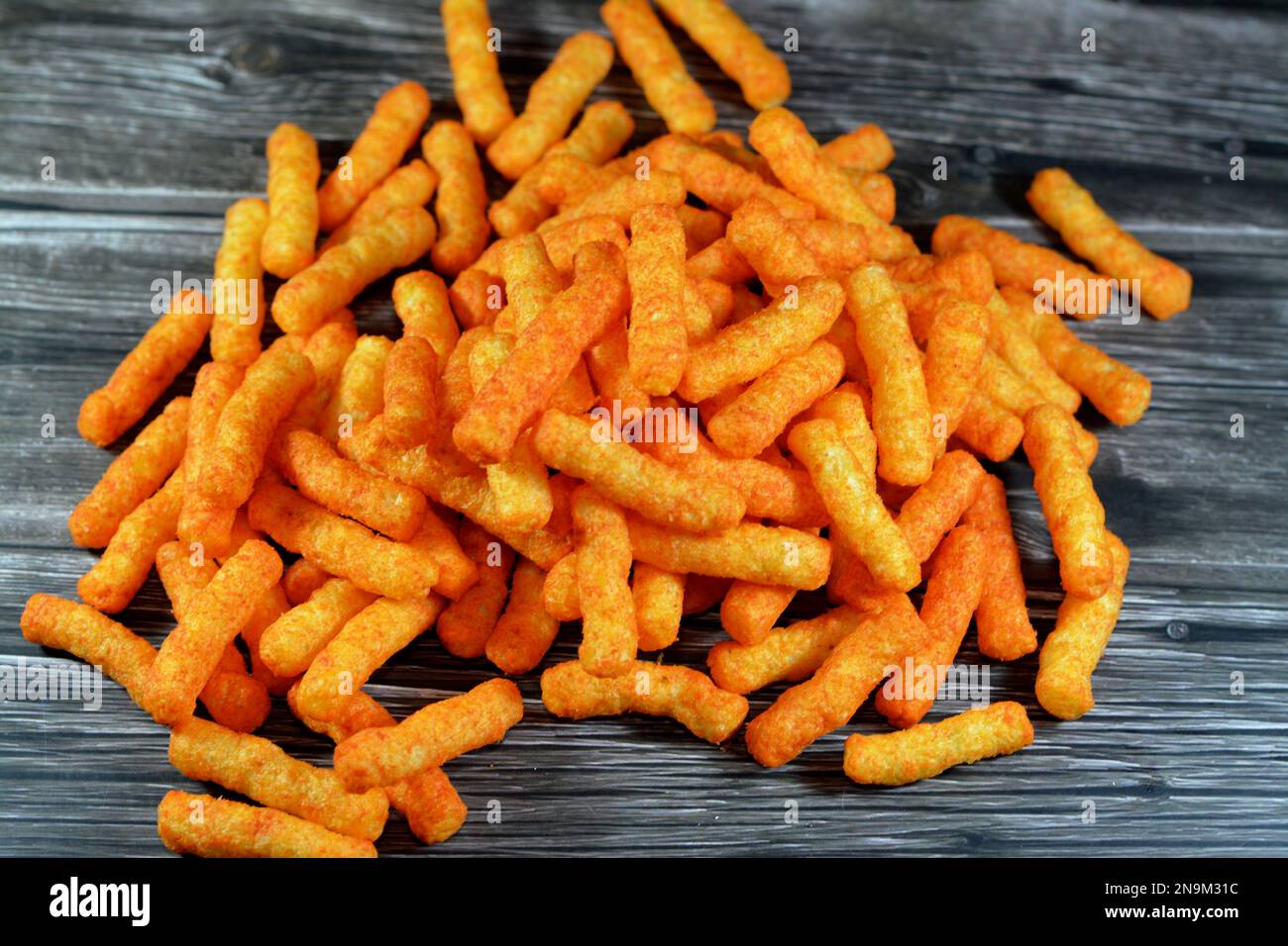 Enriched corn meal that contain flavors and milk ingredients with oil