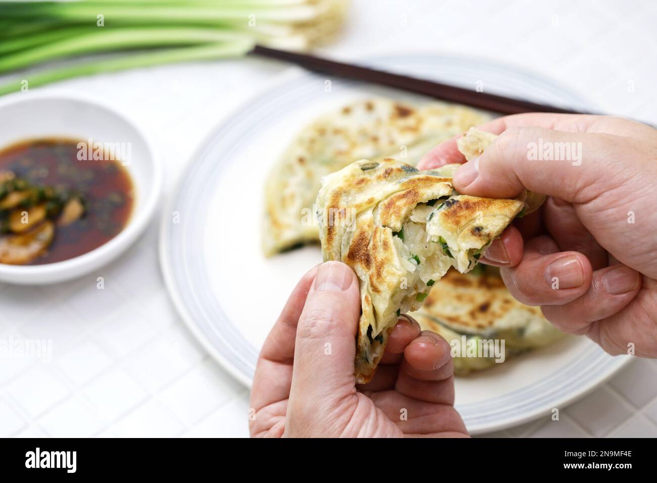 Homemade Chinese green onion pancakes. The inside is layered. Stock Photo