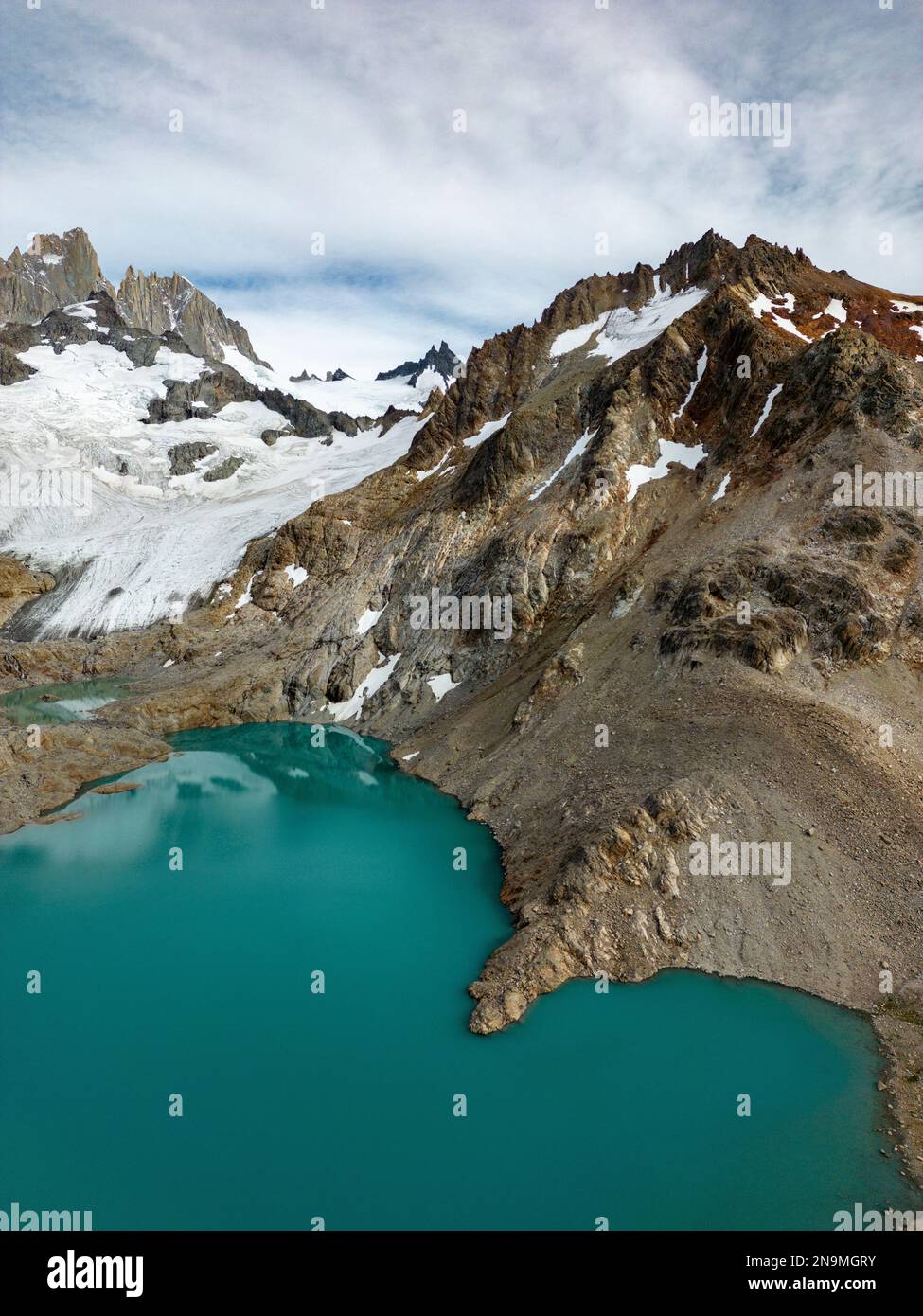 Aerial view of the stunning Mount Fitz Roy landscape with icefields and turquoise lagoons - famous sight when hiking in El Chaltén, Patagonia Stock Photo