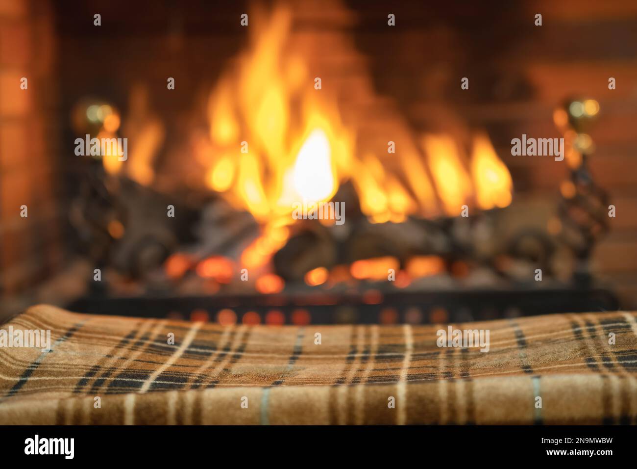 Blanket to keep warm in front of the cozy fire of the fireplace inside
