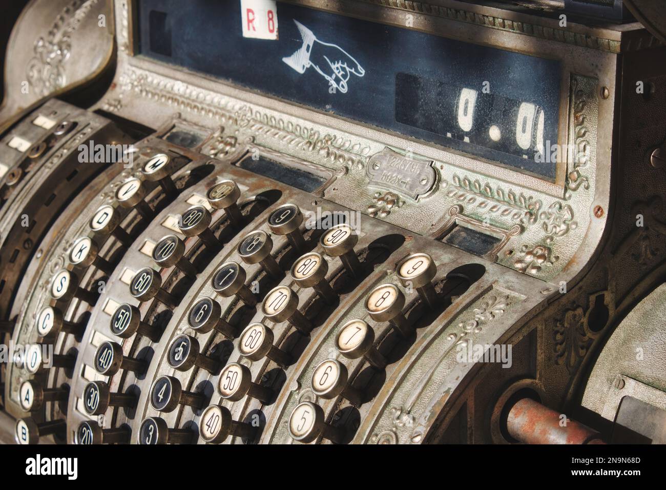 Close-up of an old antique metallic commercial cash register Stock Photo