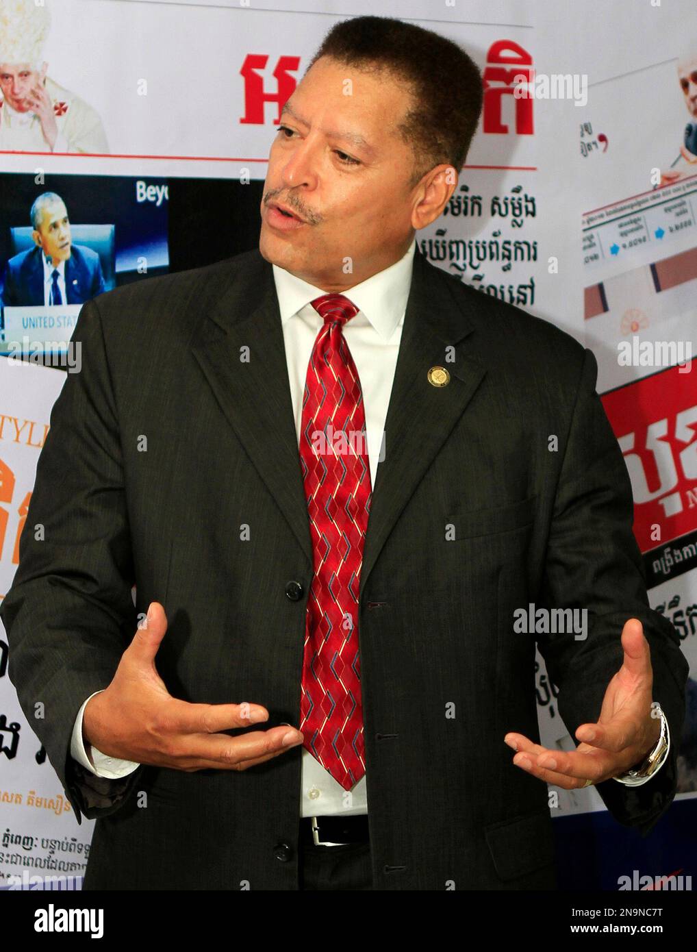 James A. Wynn, Jr. of the U.S. Federal Court of Appeals for the Fourth  Circuit, gestures during a press conference at the office of main local  newspaper Phnom Penh Post in Phnom