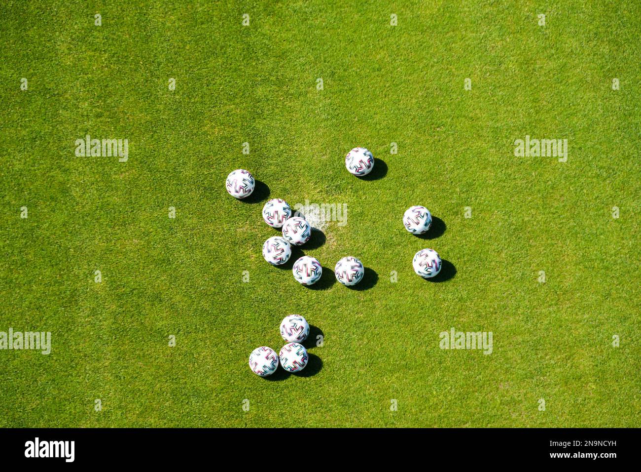 Soccer balls on soccer field top view Stock Photo
