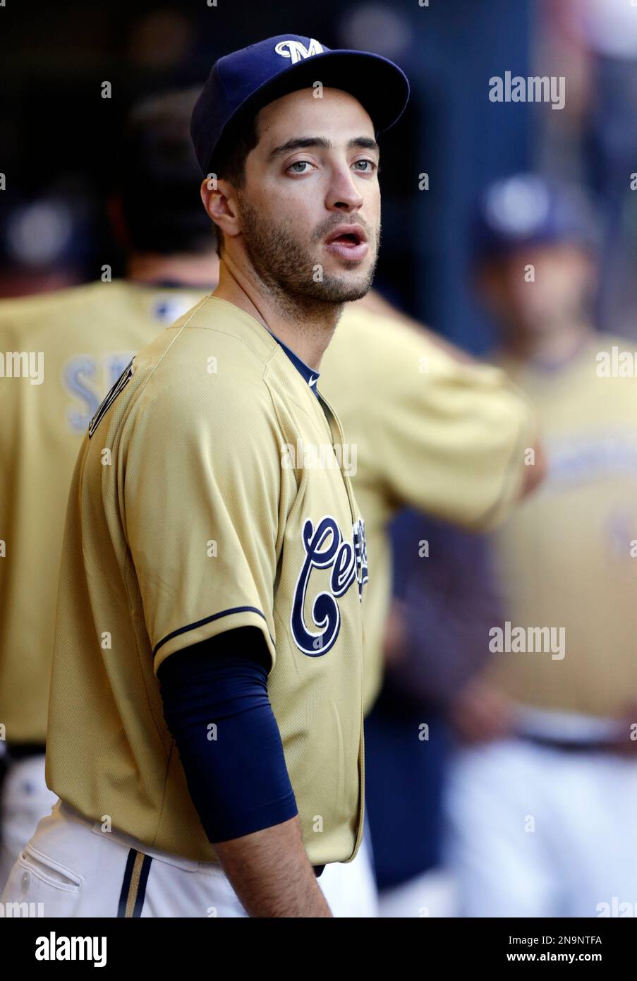 Milwaukee Brewers' Ryan Braun watches from the dugout during the