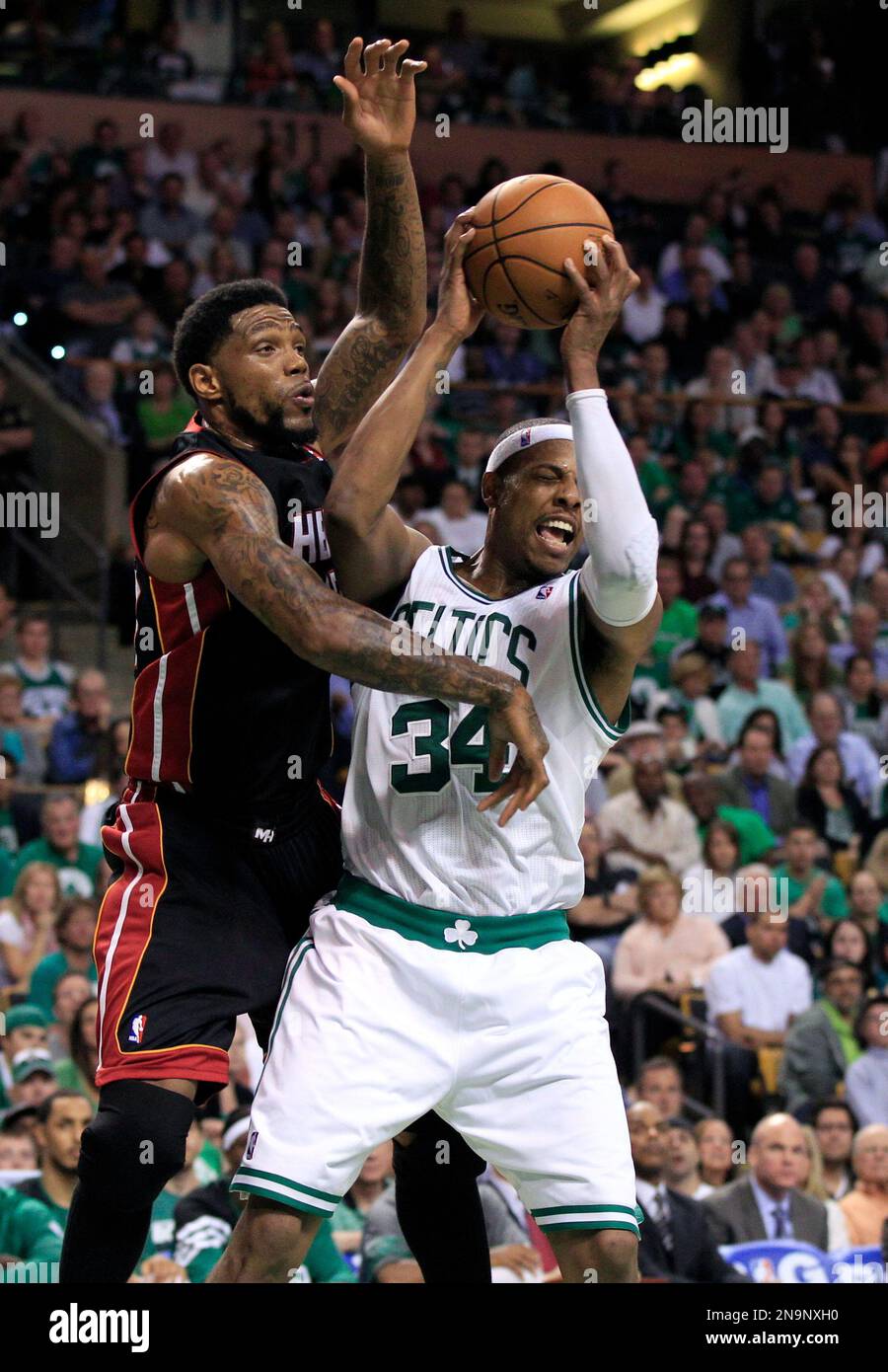 Miami Heat forward Udonis Haslem, left, defends against Boston Celtics forward Paul Pierce (34) during the fourth quarter of Game 3 in their NBA basketball Eastern Conference finals playoff series in Boston Friday, June 1, 2012. Boston won 101-91. (AP Photo/Elise Amendola) Stock Photo