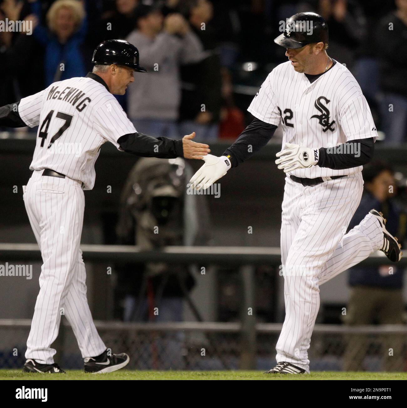 Chicago White Sox's Adam Dunn, right, celebrates with third base coach ...