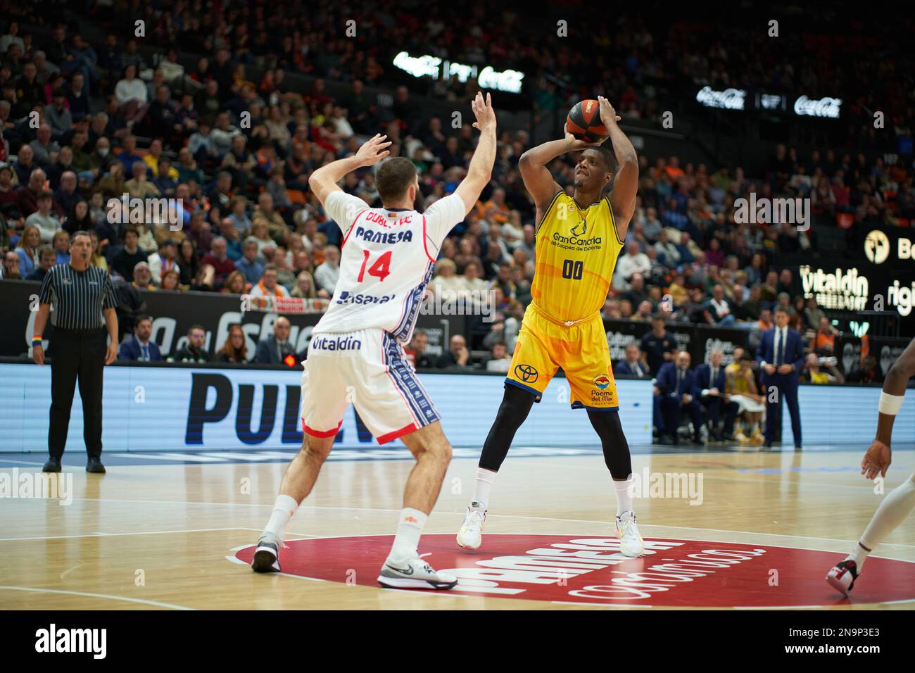 Bojan Dublevic of Valencia basket (L) and Damien Inglis of Gran Canaria (R) in action during the J20 Liga Endesa at Fuente de San Luis Sport Hall (Val Stock Photo