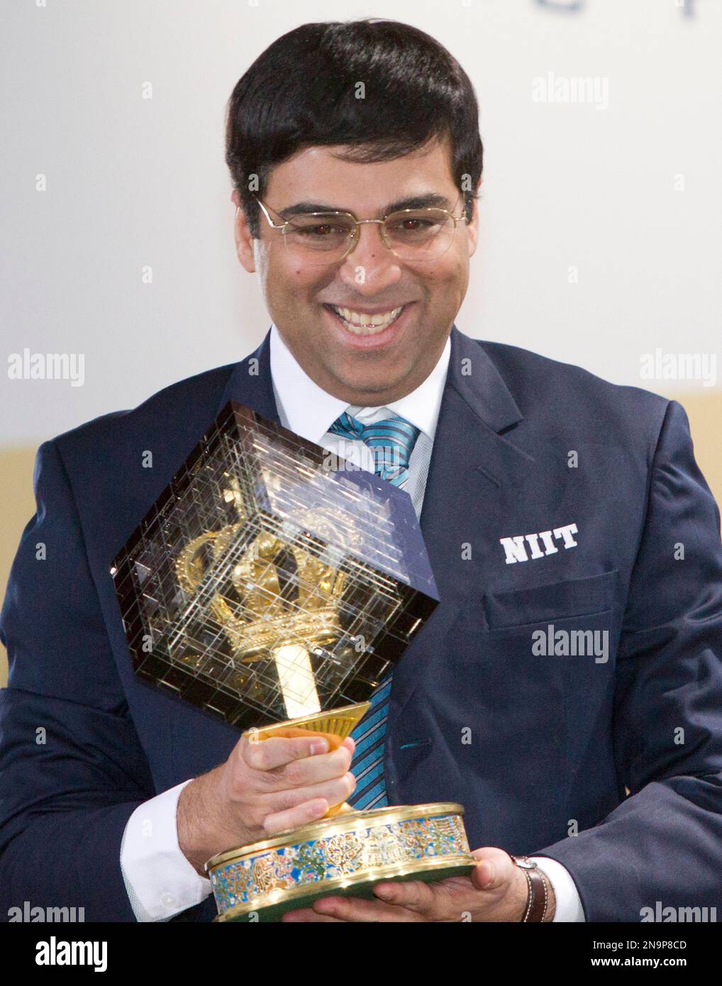 World chess champion Viswanathan Anand of India holds a trophy at an award  presentation ceremony of the FIDE World Chess Championship in Moscow,  Russia, Thursday, May 31, 2012. Anand oretained his title