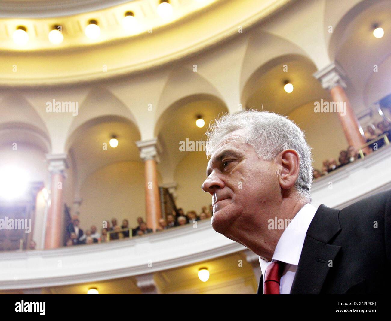 Serbian President Tomislav Nikolic leaves at a parliament inauguration ...