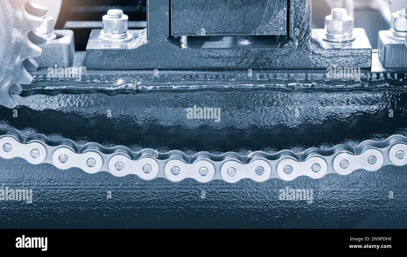 Gear chain drive shaft in conveyor belt is on production line. Timing