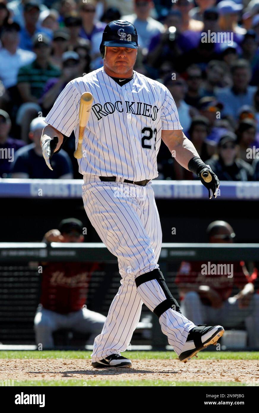 Colorado Rockies' Jason Giambi (23) reacts swinging for a strike