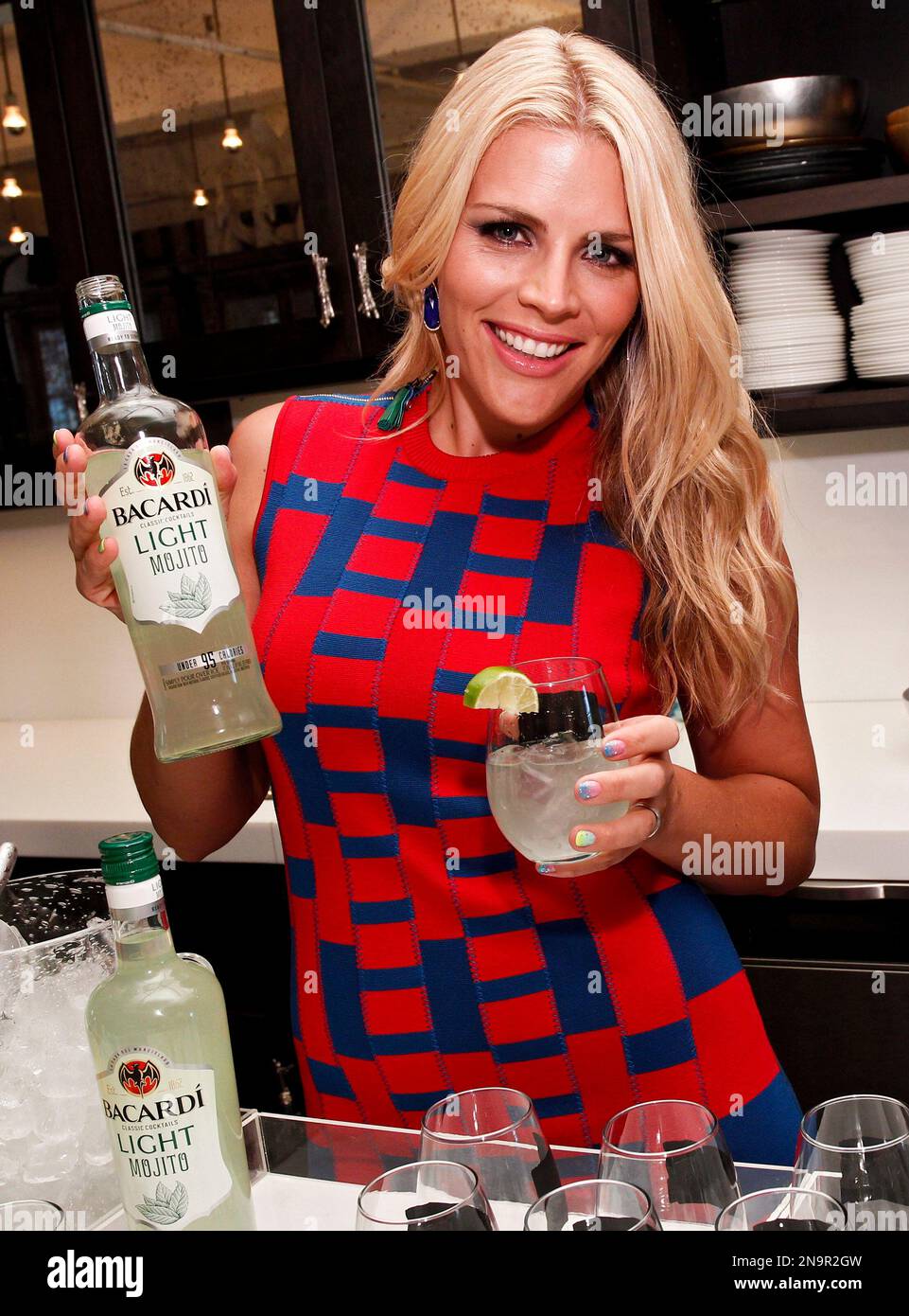 Actress Busy Philipps pours herself a BACARDI Classic Cocktails Light