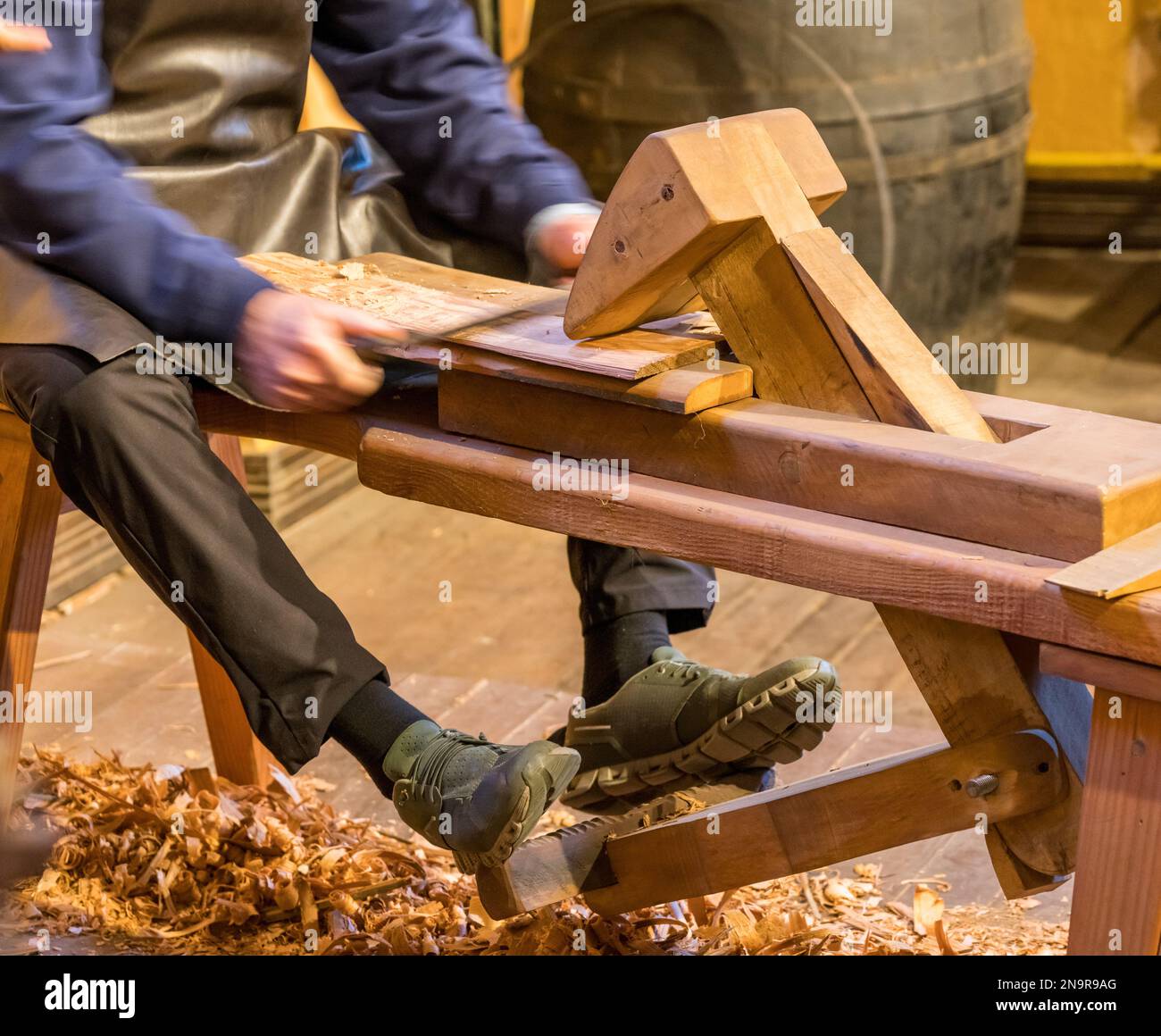 Traditional shaving horse clamp for cooper making a section of barrel Stock Photo